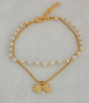 Set de Pulsera en Covergold con Perlas y Dije de Moño